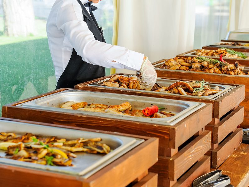 Outdoor Cuisine Culinary Buffet Dinner Catering. Group of people in all you can eat. Dining Food Celebration Party Concept. Service at business meeting, weddings. Selective focus